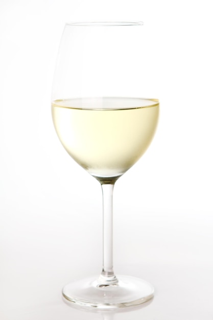 A glass of white wine isolated over background