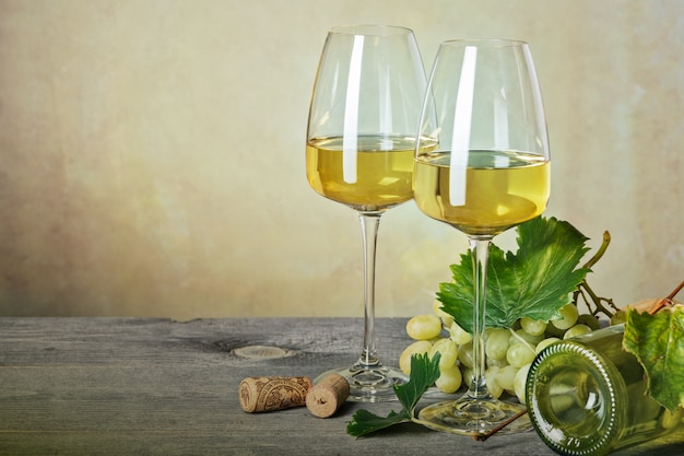 Glass of white wine on vintage wooden table