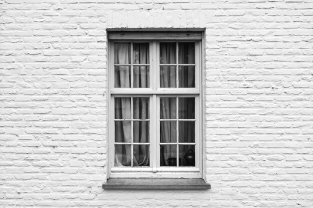 Photo glass window on brick wall