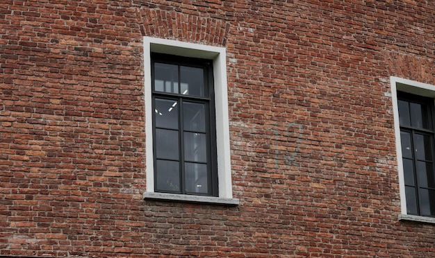 Glass windows on brick wall