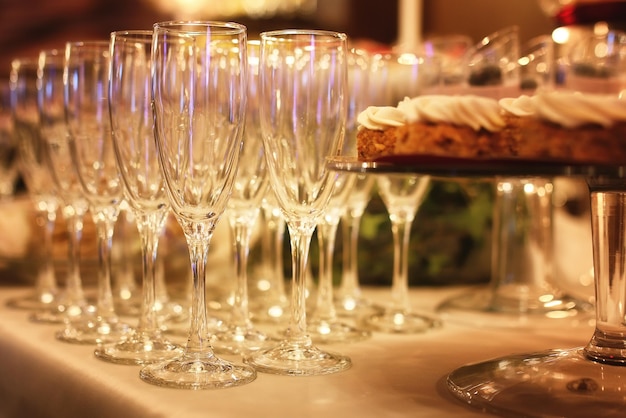 Glass wine glasses on the table served for the reception in the restaurant