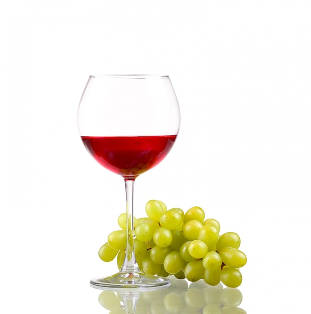 Glass of wine and grapes, isolated on white