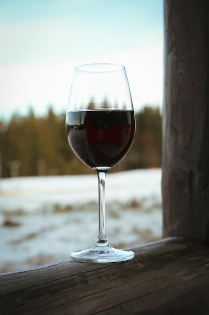 Glass of wine outdoor in winter day