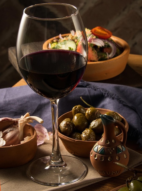 Glass of wine on a table with dishes