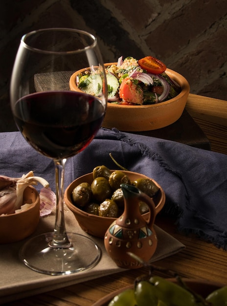 Glass of wine on a table with dishes