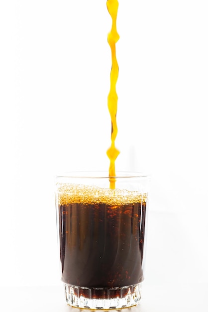 Glass with black coffee on white background