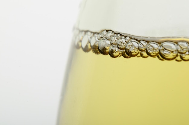 Glass with champagne and pearls