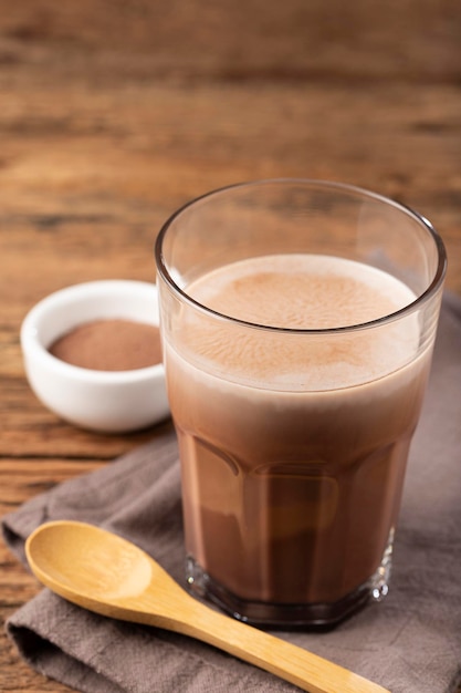 Glass with chocolate on the table