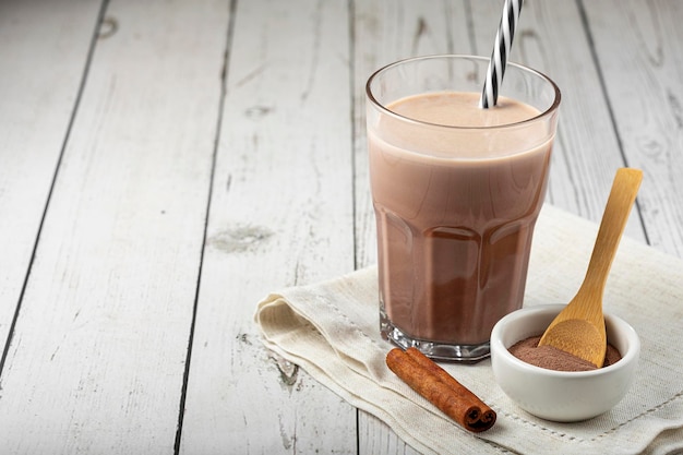 Photo glass with chocolate on the table