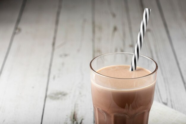 Glass with chocolate on the table