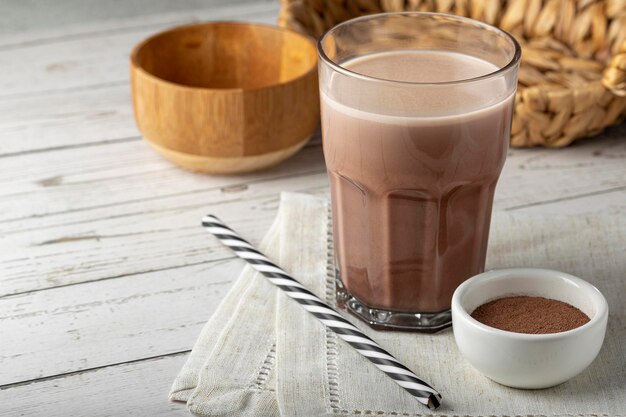 Photo glass with chocolate on the table