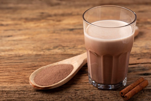 Glass with chocolate on the table