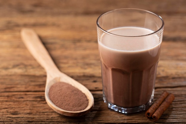 Photo glass with chocolate on the table