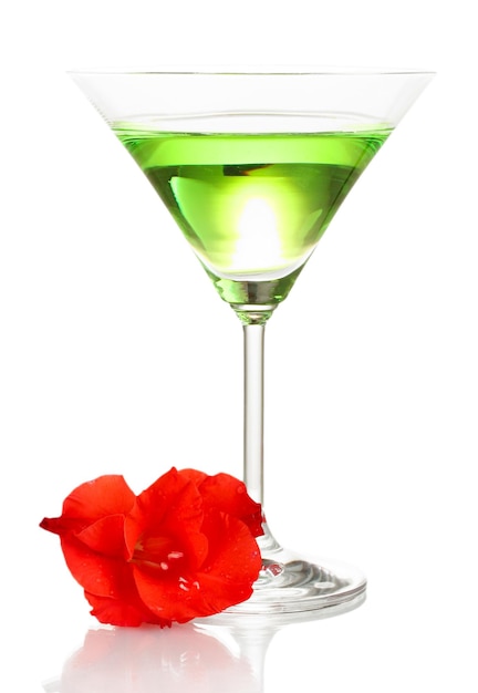 Glass with cocktail and gladiolus bud isolated on white