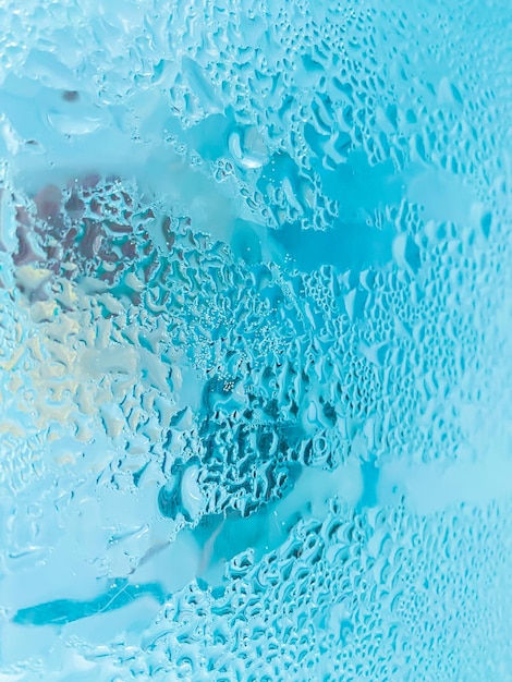 A glass with condensation on a rainy daybackground