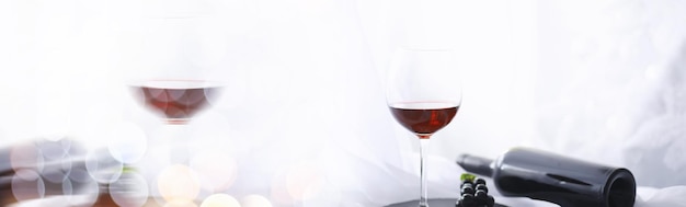 Glass with grape red semi-dry wine. Valentine's day concept background. Gift for the holiday. Sweet sparkling wine.