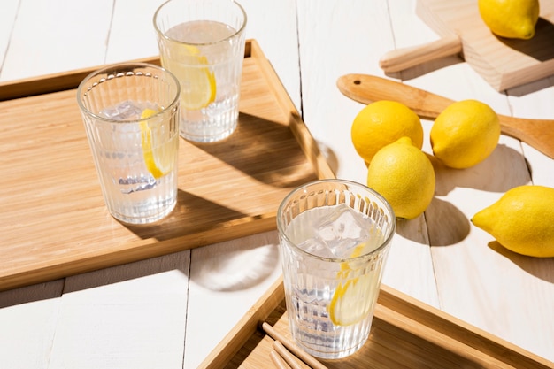 Photo glass with lemon drink in tray