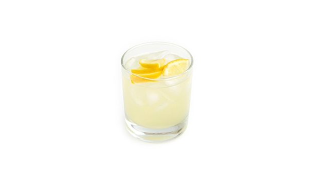 Glass with lemon lemonade and ice.