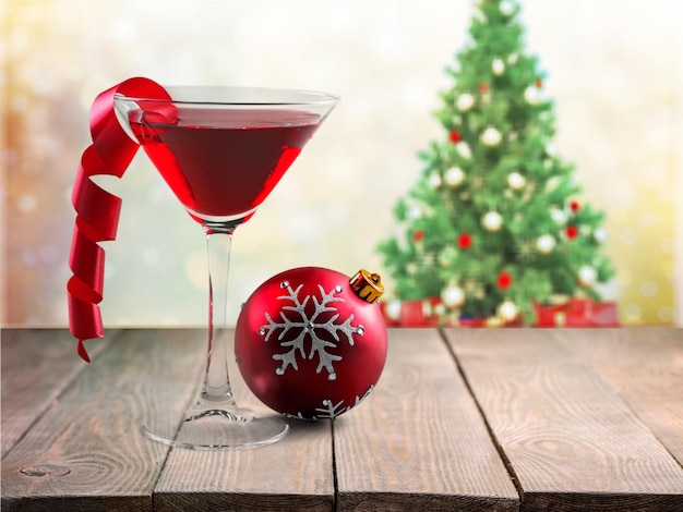 Glass with martini cocktail on festive background