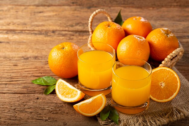 Glass with orange juice on the table.