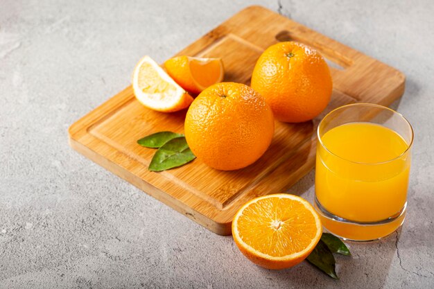 Glass with orange juice on the table.