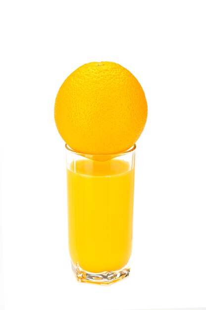 Glass with orange juice on the white