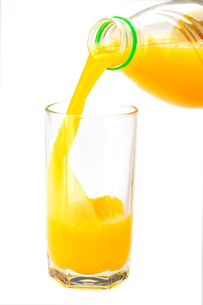 Glass with orange juice on the white