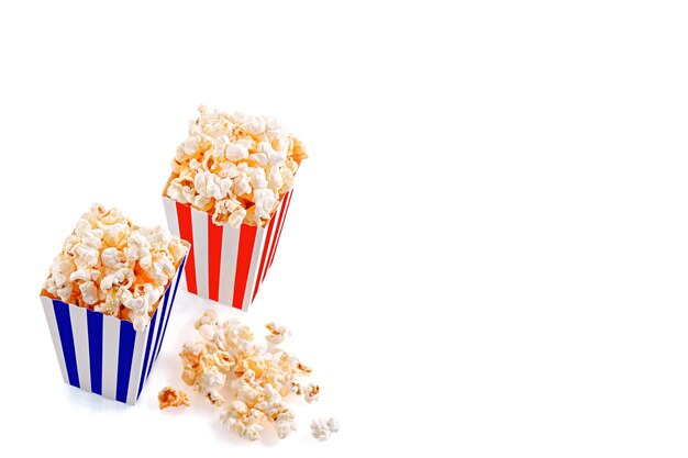 Glass with popcorn on a white background closeup