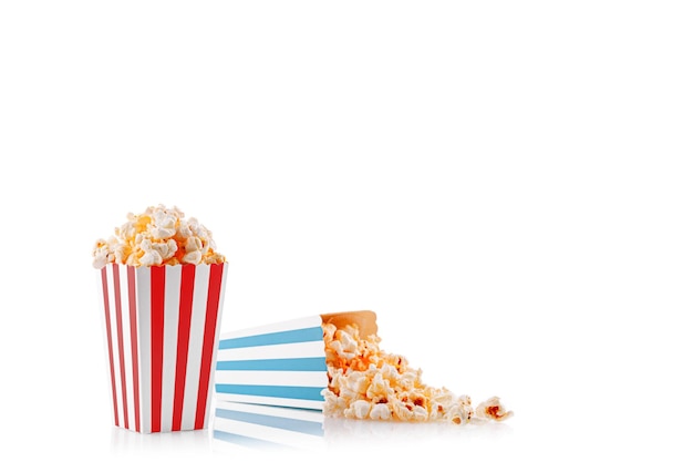 Glass with popcorn on a white background