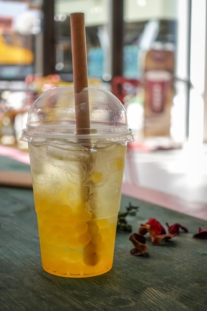 Glass with refreshing drink bubble tea with ice