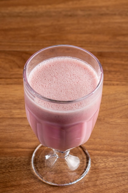 Glass with tasty strawberry smoothie