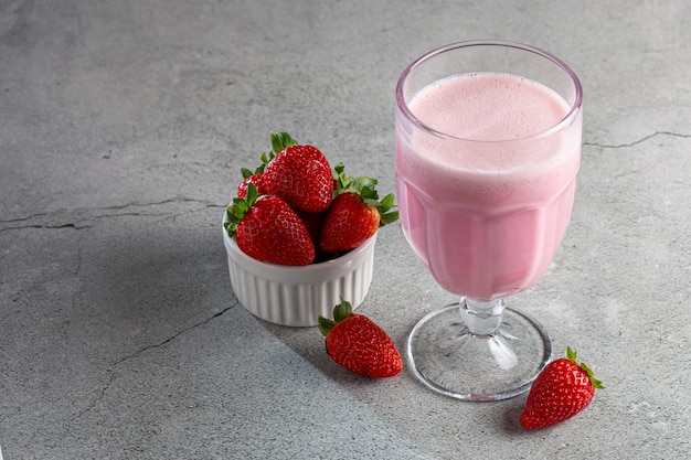 Glass with tasty strawberry smoothie