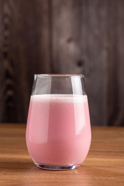 Glass with tasty strawberry smoothie