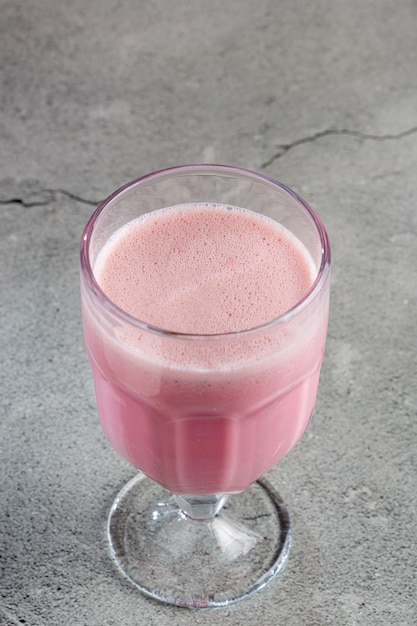 Glass with tasty strawberry smoothie