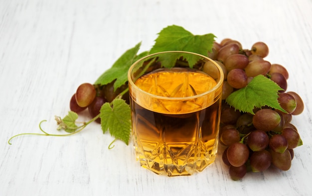 Glass with wine and white grape