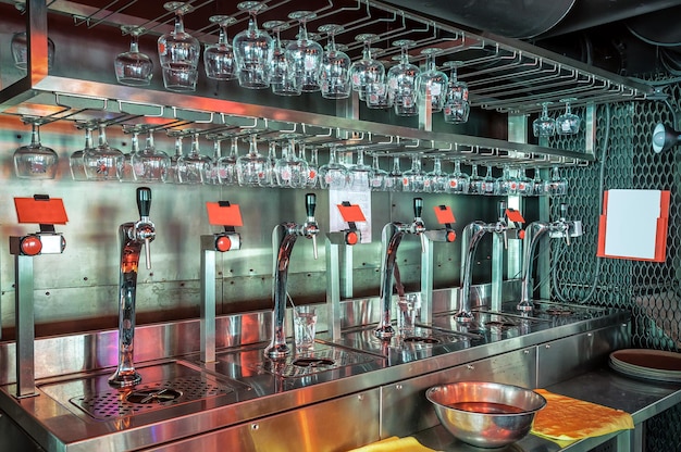 Glasses and beer taps in bar