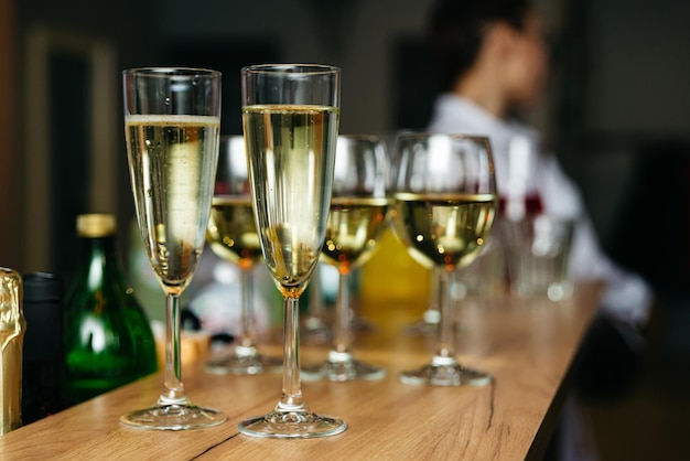 Glasses of champagne on a bar counter in a restaurant Selective focus
