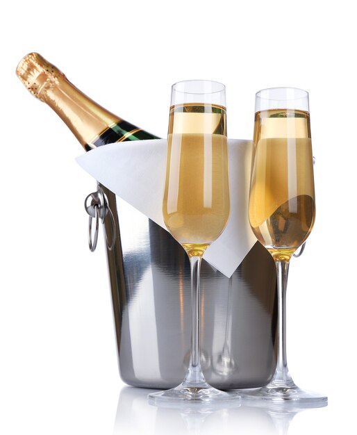 Glasses of champagne and bottle in pail isolated 