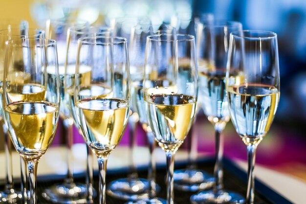 Glasses of champagne and sparkling wine served at charity event\
alcoholic drinks