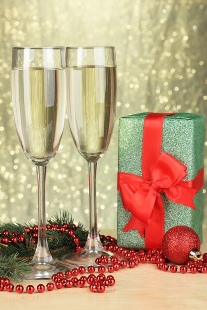 Glasses of champagne with gift box