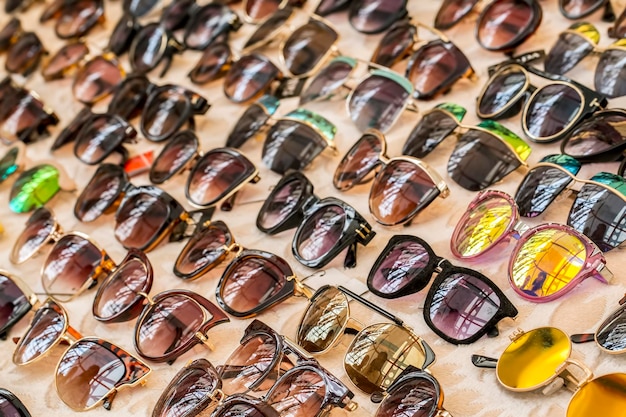 Glasses, Eyeglasses Optical Store, Fashion eyewear at market, Colorful glasses, Glasses on shelf, Glasses in optical store shopping mall