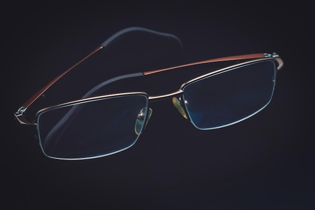 Glasses in fashionable frames on a black background