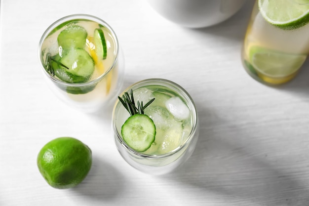 Glasses of fresh lemonade on table