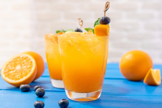 Glasses of fresh orange juice drinks