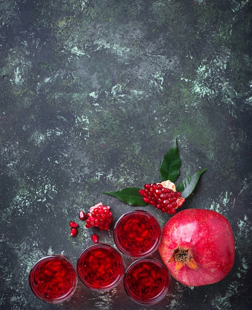 Glasses of fresh pomegranate juice. 