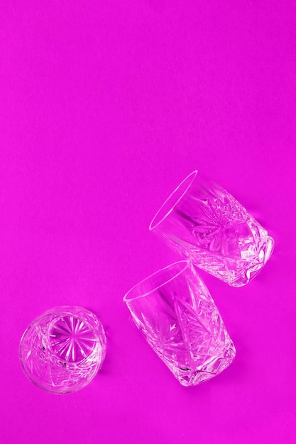 Glasses on fuchsia background