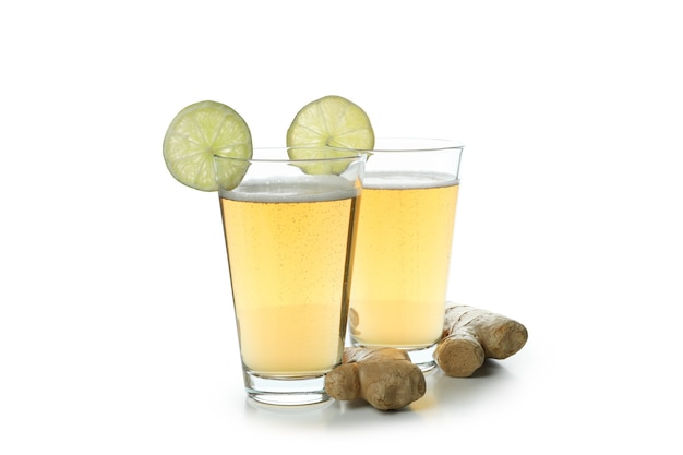 Glasses of ginger beer isolated on white