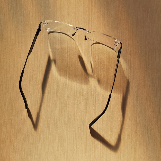 Glasses on a gray table and shadows from them