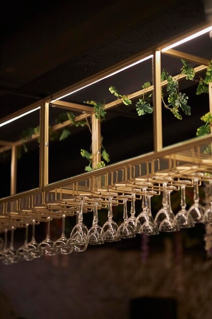 glasses hang over the bar in the restaurant champagne glasses hanging over the bar in the bar