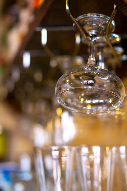 Glasses hanging over the bar on a blurred background glasses and glasses